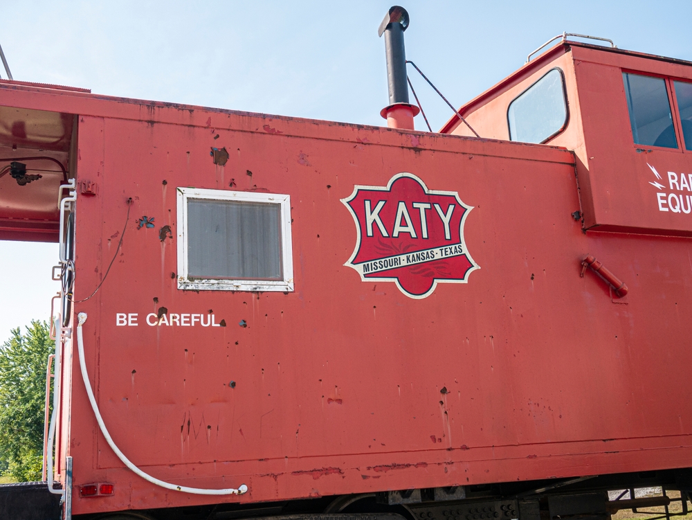 Vintage Katy Railroad caboose with clear Missouri-Kansas-Texas lettering, historic 1900s era